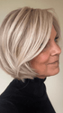 Susan Sparks @sparkles_intheworld wearing STRAIGHT UP WITH A TWIST by RAQUEL WELCH WIGS in color SS19/23 SHADED BISCUIT | Cool Platinum blonde with subtle highlights and medium brown roots