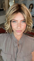 Madeline wearing AUSTEN by BELLETRESS in  CARAMEL TOFFEE BLONDE-R | Toffee is a warm, dimensional shade blending medium brown with golden blonde and caramel highlights. Softly rooted for a natural, sun-kissed finish.