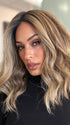 Model is wearing COREY by ENVY in color HONEY BREEZE | A blend of Cool, Honey Blonde and Multi-Dimensional Medium Brown with Darker Brown Roots