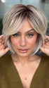 Roxie wearing WINTOUR by BELLETRESS in COOL CHAI BLONDE-R | A balanced cool blonde with softly contrasted darker roots, a fresh twist on classic blonde tones.