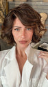Madeline wearing HOUSTON by TRESSALLURE in FRENCH ROAST BROWN-R  | A deep, luxurious brunette featuring a dark brown base with warm bronze and subtle red undertones. Softly rooted for natural depth and dimension.