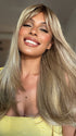 Roxie wearing NEXT TOP MODEL by TRESSALLURE in 14/23/R8 | Light Brown blended with Platinum Blonde, Shaded with Dark Roots