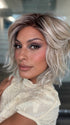 Roxie wearing BROADWAY by BELLETRESS in MILKSHAKE BLONDE R | A mixture of Light Sandy Brown, Highlighted with Light Ash Blonde with a Hint of Light Platinum Blonde with a Medium Root Color