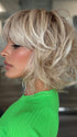 Roxie wearing FLAWLESS WAVES by TRESSALLURE in 19/23/R12 | A beautiful blend of Platinum Blonde and Pale Golden Blonde, shaded with Dark roots
