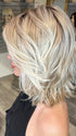 Madeline wearing PARK AVE by BELLETRESS in MILKSHAKE BLONDE R | A mixture of Light Sandy Brown, Highlighted with Light Ash Blonde with a Hint of Light Platinum Blonde with a Medium Root Color