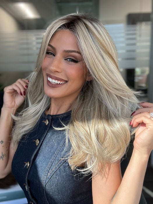 Roxie is wearing BEAUTY REIGN by GABOR in color GF19-23SS BISCUIT | Light Ash Blonde Evenly Blended with Cool Platinum Blonde with Dark Roots