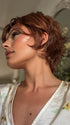 Roxie wearing ASHA by RENE OF PARIS in CAFE ROUGE R | A dimensional auburn copper blend with rich reddish-brown roots melting into warm copper highlights