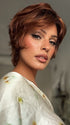 Roxie wearing ASHA by RENE OF PARIS in CAFE ROUGE R | A dimensional auburn copper blend with rich reddish-brown roots melting into warm copper highlights