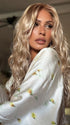 Roxie wearing PHILLIPA by RENE of PARIS in WINTER OAT LATTE R | rooted honey blonde and platinum blonde blend with soft, dimensional highlights and lowlights