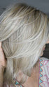 Sandy @i_be_wiggin wearing MALIBU by BELLETRESS in color CRUSHED ALMOND BLONDE R | A soft Neutral Light Blonde with a Light and Medium Blended Root Color.