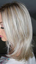 Sandy @i_be_wiggin wearing MALIBU by BELLETRESS in color CRUSHED ALMOND BLONDE R | A soft Neutral Light Blonde with a Light and Medium Blended Root Color.