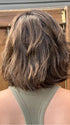 Steph @wigswithsteph wearing ESPRIT by ELLEN WILLE in color DARK-CHOCOLATE-ROOTED 6.30.4 | Dark Brown Base with Light Reddish Brown Highlights with Dark Roots Edit alt text