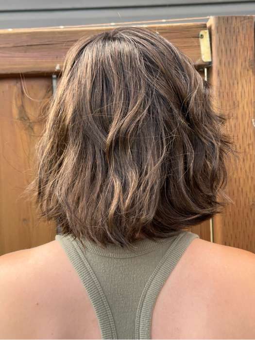 Steph @wigswithsteph wearing ESPRIT by ELLEN WILLE in color DARK-CHOCOLATE-ROOTED 6.30.4 | Dark Brown Base with Light Reddish Brown Highlights with Dark Roots Edit alt text