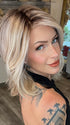 Madeline wearing PARK AVE by BELLETRESS in MILKSHAKE BLONDE R | A mixture of Light Sandy Brown, Highlighted with Light Ash Blonde with a Hint of Light Platinum Blonde with a Medium Root Color