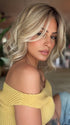Roxie wearing BRADSHAW by BELLETRESS in MILKSHAKE BLONDE R | A mixture of Light Sandy Brown, Highlighted with Light Ash Blonde with a Hint of Light Platinum Blonde with a Medium Root Color