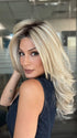 Roxie is wearing BEAUTY REIGN by GABOR in color GF19-23SS BISCUIT | Light Ash Blonde Evenly Blended with Cool Platinum Blonde with Dark Roots