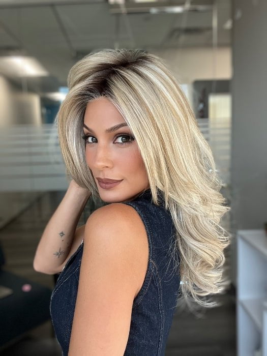 Roxie is wearing BEAUTY REIGN by GABOR in color GF19-23SS BISCUIT | Light Ash Blonde Evenly Blended with Cool Platinum Blonde with Dark Roots