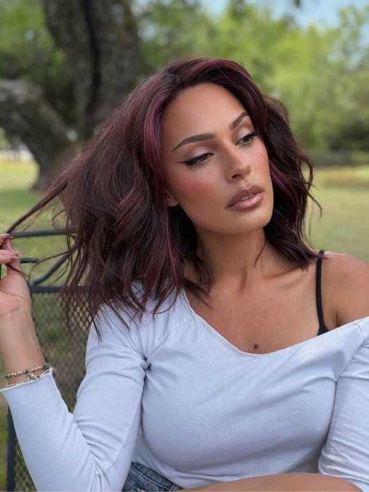 Roxie wearing SMOOTH WAVEZ by RENE OF PARIS in DUSTY-ROSE | Medium Coral Red Base with Dark Brown Roots