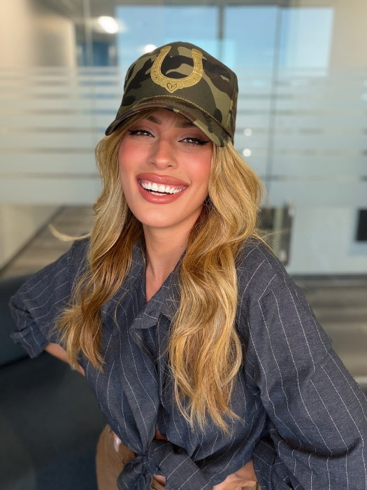 Roxie wearing POSH WAVEZ by RENE OF PARIS in Bronzed Honey-R | A perfect blend of rich, warm golden blond and medium chocolate brown tones, complemented by a dark chocolate root that adds a luxurious, dimensional effect.