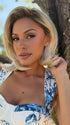 Roxie wearing THE BETTER HALF by TRESSALLURE in 613/1001/R18 | Vanilla Blonde Platinum White Blend Rooted Ash  