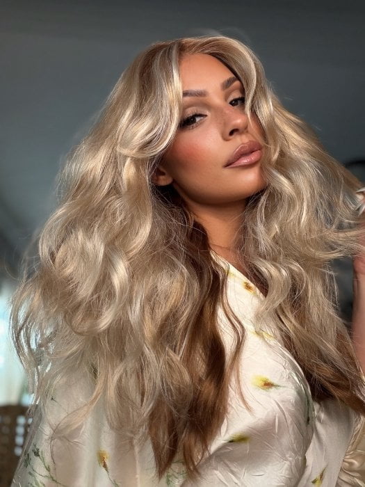 Roxie wearing PHILLIPA by RENE of PARIS in WINTER OAT LATTE R | rooted honey blonde and platinum blonde blend with soft, dimensional highlights and lowlights