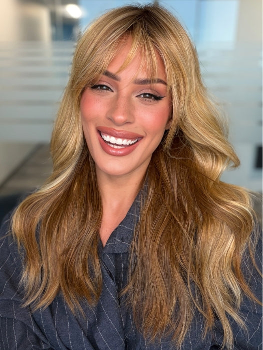 Roxie wearing POSH WAVEZ by RENE OF PARIS in Bronzed Honey-R | A perfect blend of rich, warm golden blond and medium chocolate brown tones, complemented by a dark chocolate root that adds a luxurious, dimensional effect.