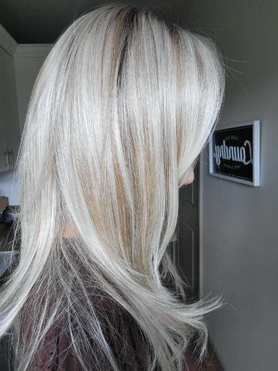 Natalie @vanish.into.thin.hair wearing LAUREN by BELLETRESS in color BURNT BISCUIT BLONDE | A Blend of Sand, Honey, and Creamy Soft Blonde with a Medium Root | inside window natural lighting