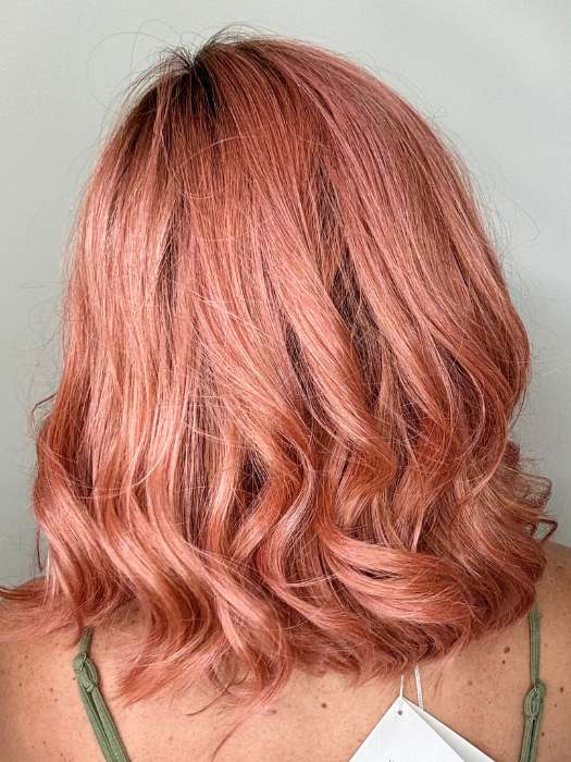 Kristyna @kristynamoore wearing PANACHE WAVEZ by RENE OF PARIS in color DUSTY-ROSE | Medium Coral Red Base with Dark Brown Roots