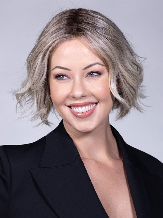 Model is wearing AUSTEN BY BELLETRESS in color COOL CHAI BLONDE-R 10/17/23+8 | A balanced cool blonde with softly contrasted darker roots, a fresh twist on classic blonde tones.