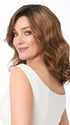 Model is wearing AMANDA by ENVY in color CINNAMON TOFFEE | Neutral to Warm Light Brown with Dark Brown Roots