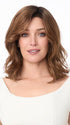 Model is wearing AMANDA by ENVY in color CINNAMON TOFFEE | Neutral to Warm Light Brown with Dark Brown Roots