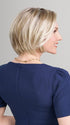 Model is wearing AVA in 22F16S8 VENICE BLONDE | Light Ash Blonde and Light Natural Blonde Blend Shaded with Medium Brown