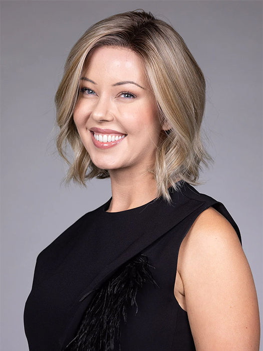 Model is wearing BUTTERCAKE BLONDE-R | A neutral-warm blonde blend featuring light brown, ash, and lightest blonde tones with natural-looking darker roots for added depth and realism.