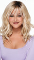 Beach Wave Magic features feathered bangs and light beach waves that rests at the shoulders