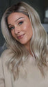 Heather @cjswigs wearing MILANO by BELLE TRESS in color MILKSHAKE BLONDE R | A mixture of Light Sandy Brown, Highlighted with Light Ash Blonde with a Hint of Light Platinum Blonde with a Medium Root Color