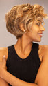 Model is wearing Twisted Pixie by TressAllure in shade EL17/23/R8 | Pale Auburn Beige Blonde Blend, Rooted Medium Brown, Highlighted Light Blonde with face framing highlights