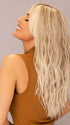 Model is wearing ROXIE by RENE OF PARIS in shade BILLIONAIRE-BLOND | A chic, sophisticated shade with a rich mocha root melting into beige, ash, and cream blond tones. Face-framing cream and white blond highlights add a refined, upscale finish.