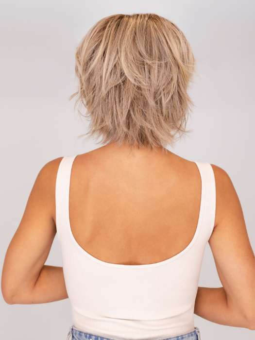 Model is wearing MAIN CHARACTER by RAQUEL WELCH in shade RL17/23SS ICED LATTE MACCHIATO | Honey Blonde shaded with Cool Blonde with Dark Roots