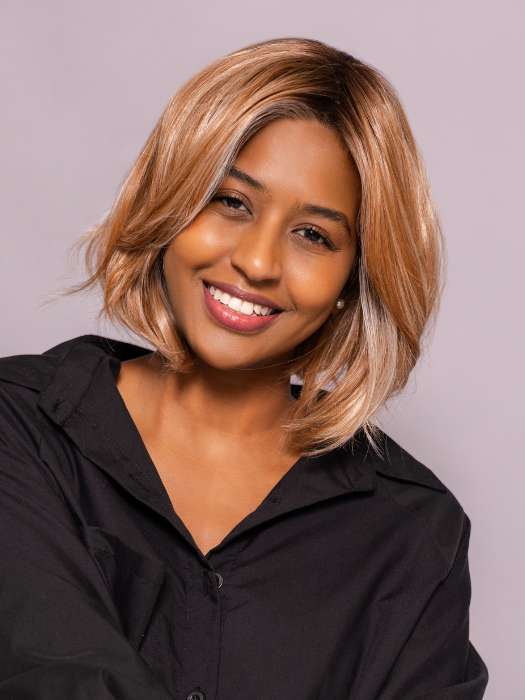Model is wearing MIRA by AMORE in color CINNAMON FROST R | Warm, medium coppery-brown base with white-blond highlights. The medium brown root color adds a realistic vibe.   