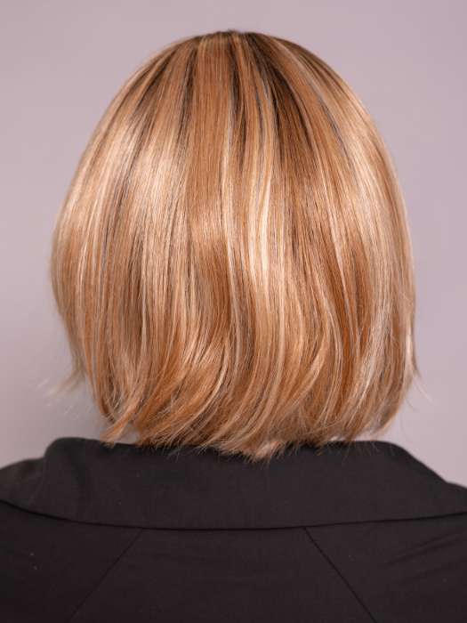 Model is wearing MIRA by AMORE in color CINNAMON FROST R | Warm, medium coppery-brown base with white-blond highlights. The medium brown root color adds a realistic vibe.   