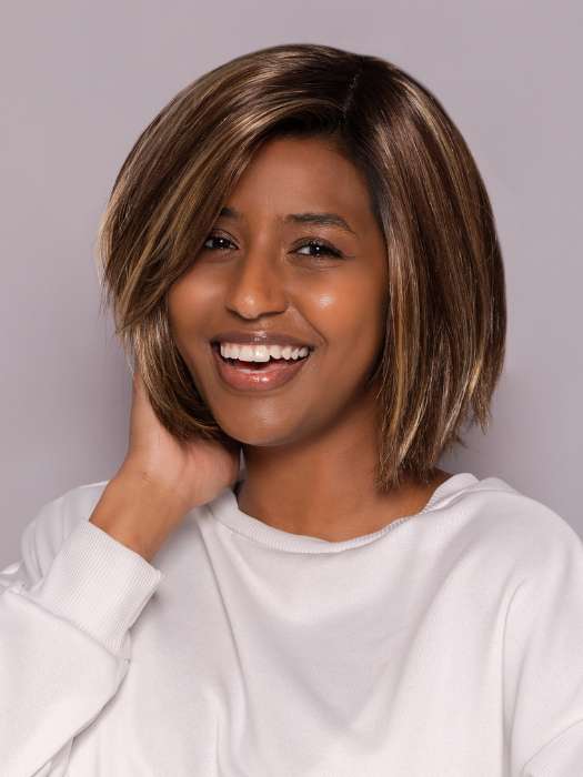 Model is wearing LUMI by ESTETICA in color CKISSRT4 | Golden Brown with Copper Blonde Highlights and Dark Brown Roots