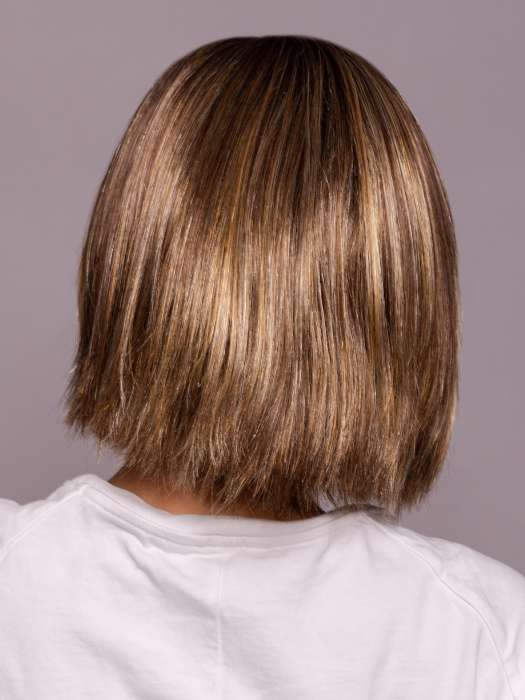 Model is wearing LUMI by ESTETICA in color CKISSRT4 | Golden Brown with Copper Blonde Highlights and Dark Brown Roots