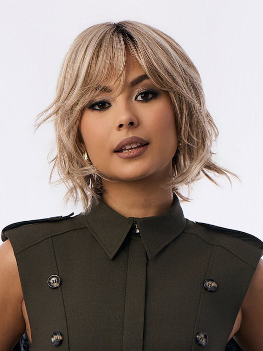 Model is wearing BRANN in SANDY BEIGE BLONDE R | Carefully placed shades of dark sandy blonde and light neutral blonde with medium root tone for added depth.         