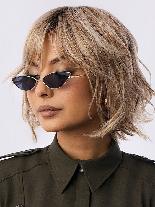 Model is wearing BRANN in SANDY BEIGE BLONDE R | Carefully placed shades of dark sandy blonde and light neutral blonde with medium root tone for added depth.         