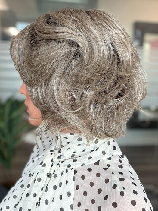 Model is wearing BRANN in color GREIGE-R | A perfect blend of silver-grey and beige tones with medium brown root