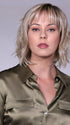 Model is wearing BROADWAY By BELLETRESS in CRUSHED-ALMOND-BLONDE-R | A Soft Neutral Light Blonde with a Light and Medium Blended Root Color