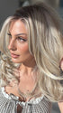 Roxie wearing BROOKLYN by BELLE TRESS in color MILKSHAKE BLONDE R | Mixture of Light sandy brown, highlighted with light ash blonde with a hint of light platinum blonde with medium root color.