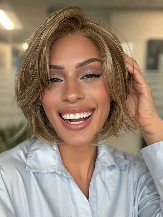 Roxie is wearing CLOVER by ESTETICA in color R12/26CH | Light Brown with Chunky Golden Blonde Highlights