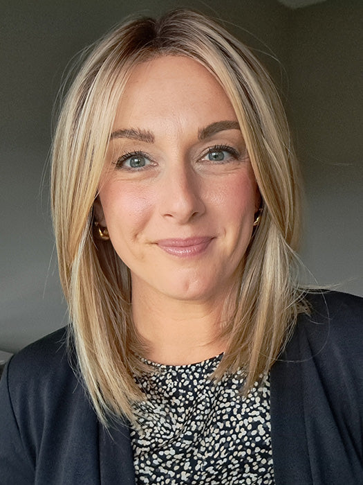 Ashley is wearing CHELSEA by BELLE TRESS in color RAW SUGAR BLONDE | A Neutral Light Blonde, Honey Blonde, Pale Gold Blonde, with a base of Light Brown Lowlights featuring a Medium Root Color