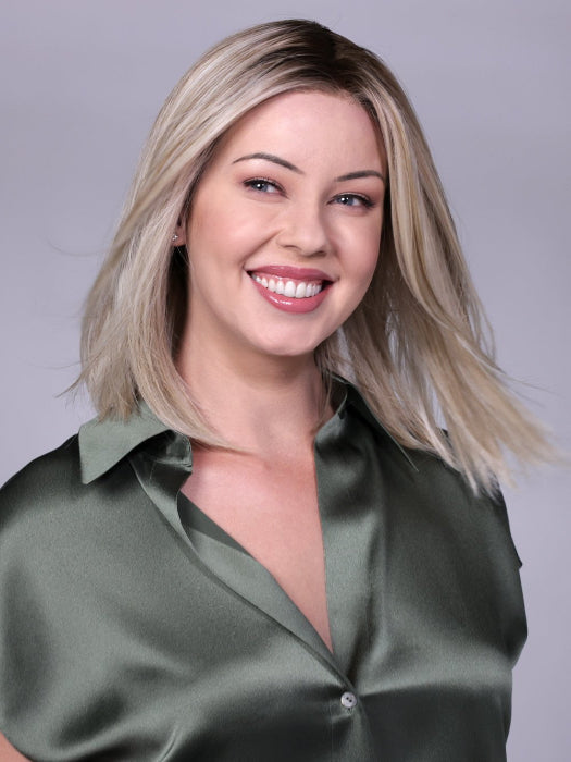 Model is wearing CHELSEA by BELLETRESS in CRUSHED-ALMOND-BLONDE-R | A soft Neutral Light Blonde with a Light and Medium Blended Root Color